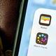 A photo of an iPhone with focus on the Wallet app